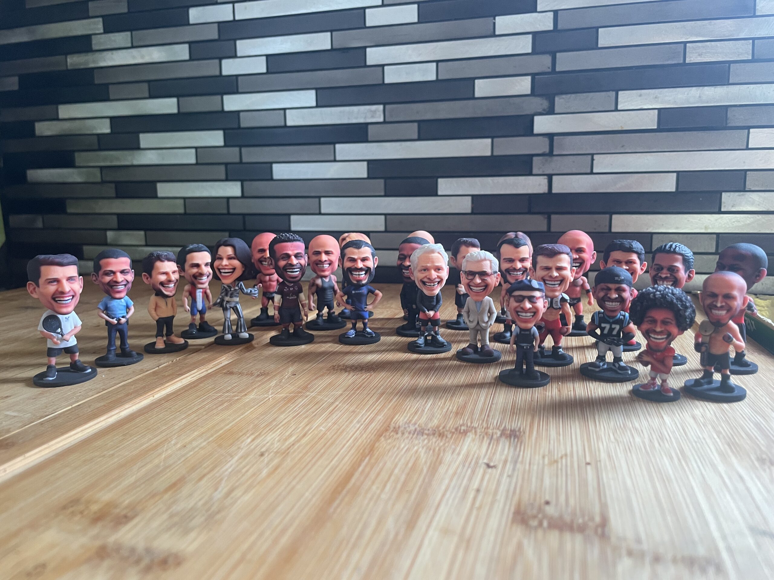 A large group of custom bobblehead figurines from a business event